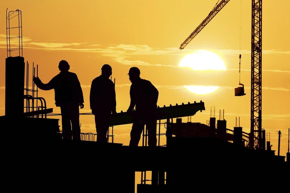 Construction team at sunset, from the Khedekar's company profile
